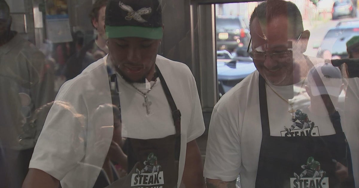 Saquon Barkley Celebrates Madden 26 Cover at Geno's Steaks