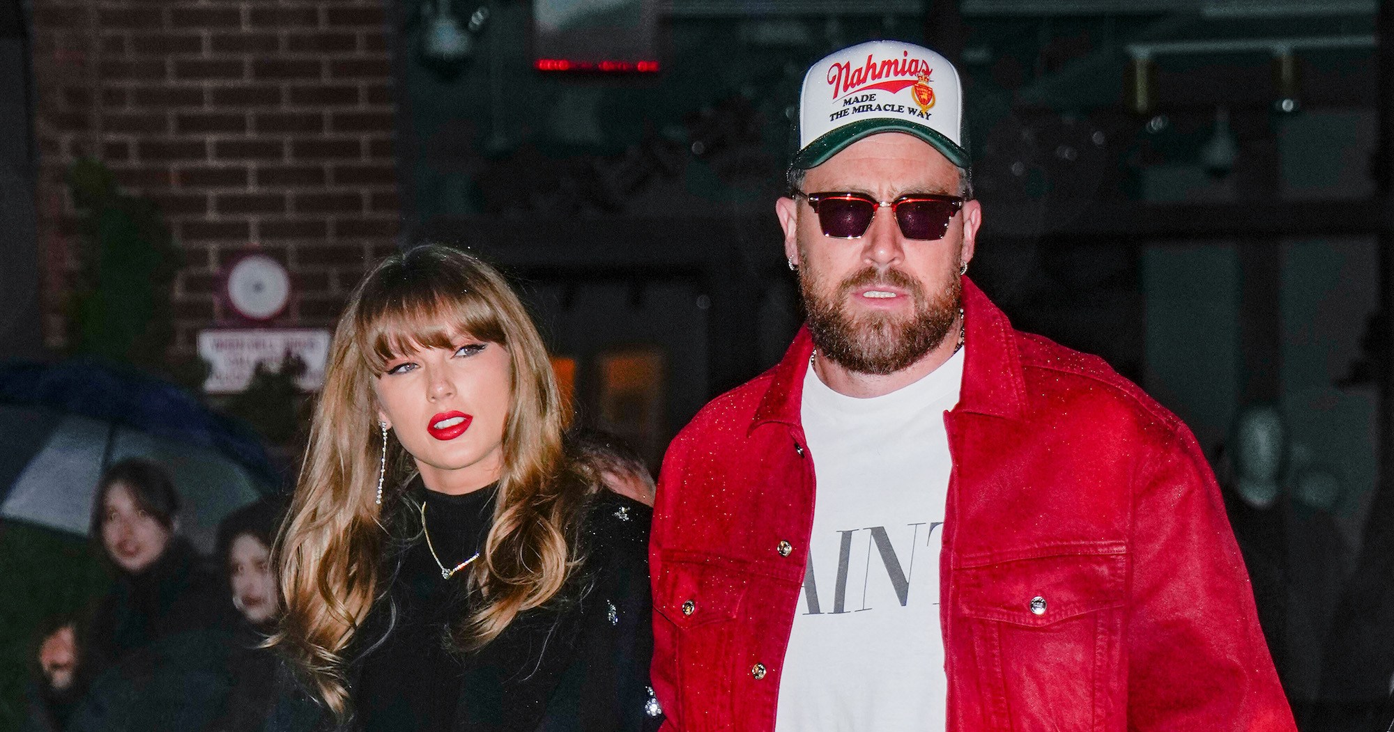 Taylor Swift and Travis Kelce Share a Kiss at Tight End University Opening